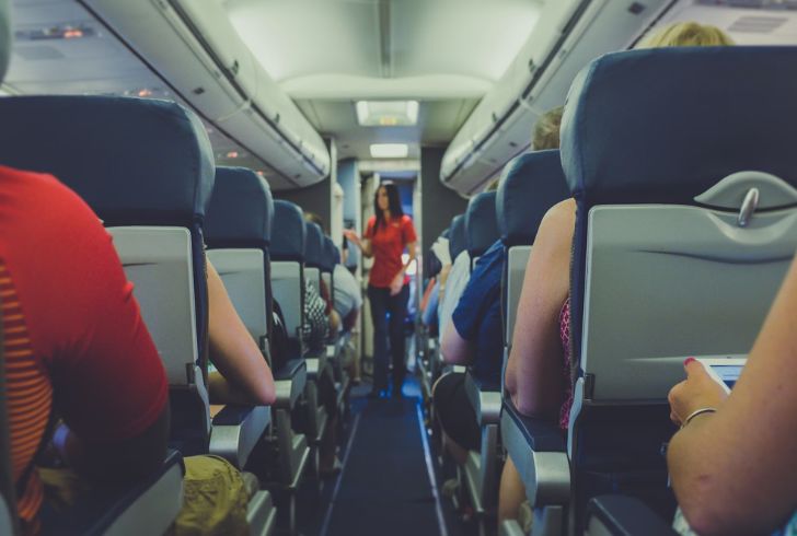 Airplane seat-switching can pose safety risks and lead to removal from the flight.