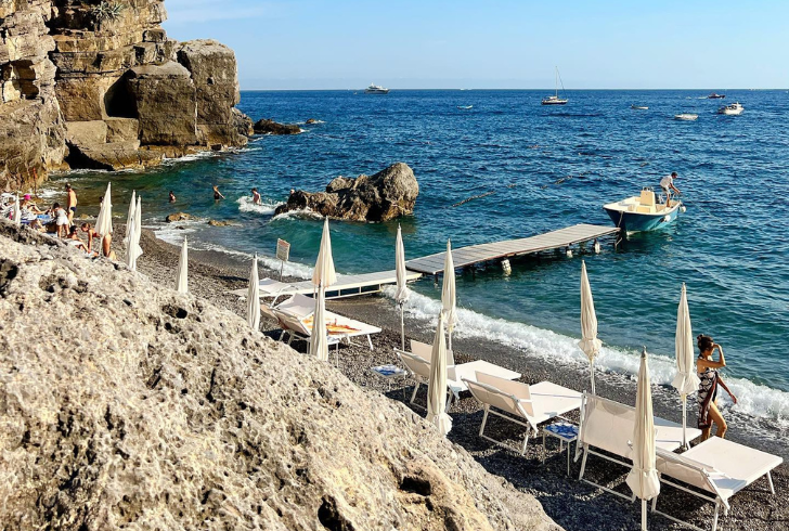 Indulge in the wild allure of Spiaggia di Laurito, a picturesque beach in Positano on the Amalfi Coast.